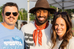 two people posing with NFL player Logan Ryan